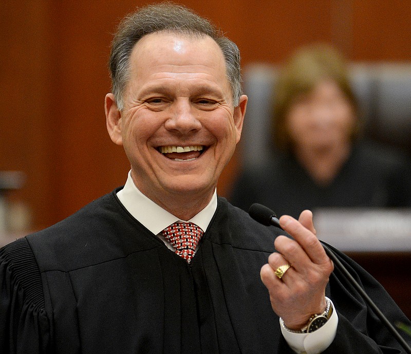 Alabama Chief Justice Roy Moore talks to the crowd after being sworn into office, at the Heflin-Torbert Judicial Building in Montgomery, Ala., in this 2013 file photo.