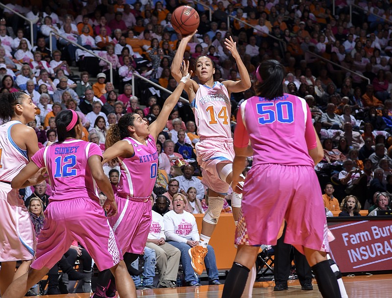 Tennessee's Andraya Carter (14) tries to to shoot over Kentucky's Jennifer O'Neil (0) during their game on Sunday, Feb. 15, 2015, in Knoxville.
