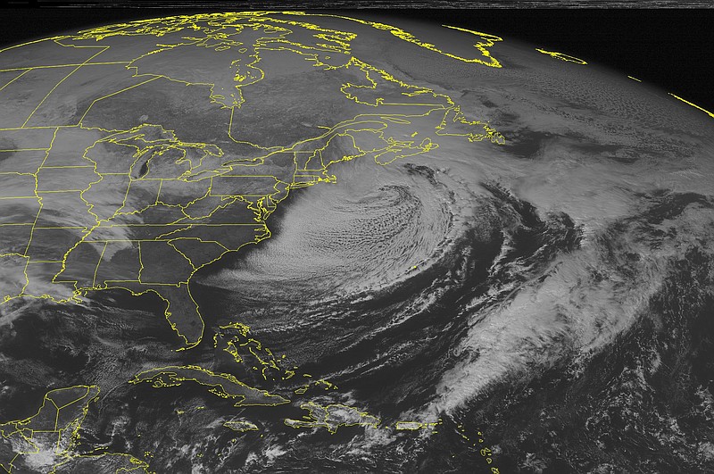 This NOAA satellite image taken Sunday, Feb. 15, 2015 at 12:45 p.m. EST shows a prominent area of clouds off the Eastern Seaboard as a powerful winter storm centered off the southeastern New England region pulls away. Clouds are streaming across the Upper and Mid Mississippi Valleys with some scattered snow as a storm system moves across the Northern Plains.