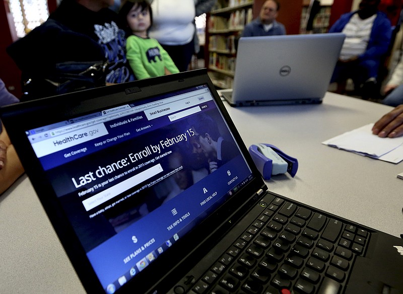A laptop shows the HealthCare.com web site during an Affordable Care Act enrollment event in this Feb. 12, 2015, photo.