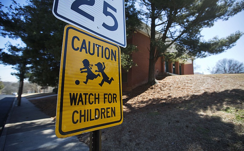 In this Friday, Feb. 13, 2015, photo, a caution sign stands in front of D.H. Stanton Elementary School in Atlanta. 