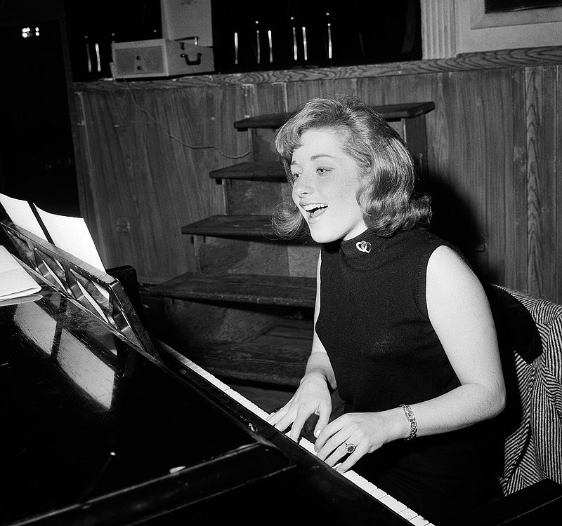 In this Jan. 5, 1966, file photo, singer Lesley Gore rehearses at a piano, in New York.