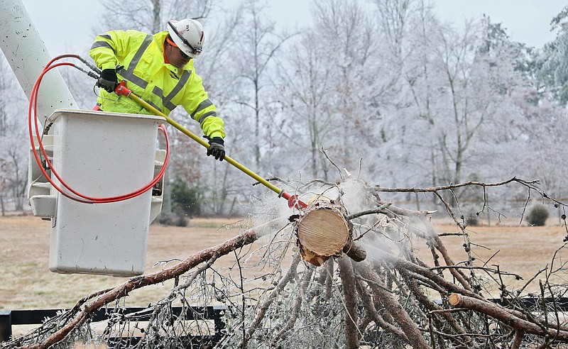 A fallen tree knocked down wires at Gaddis Rd. and Arbor Hill Rd in Cherokee County, Ga., Tuesday, Feb. 17, 2015.