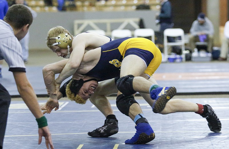 Soddy-Daisy's Tucker Russo, top, wrestles Northeast's Delrico Bowen in their TSSAA state wrestling championship A-AA 145 lb match on Feb. 14, 2015, at the Williamson County Agricultural Expo in Franklin, Tenn.
