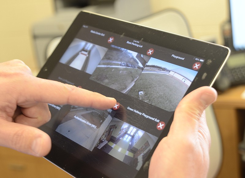 Principal Tom Arnold demonstrates the camera system at Ooltewah Elementary School in this Nov. 21, 2014 file photo.