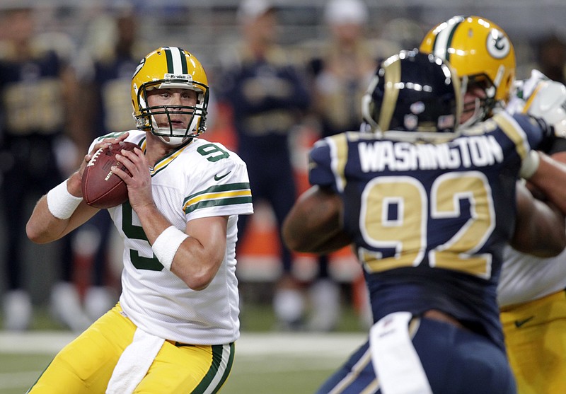 Green Bay Packers quarterback B.J. Coleman drops back to pass during his game in St. Louis in this 2013 file photo.