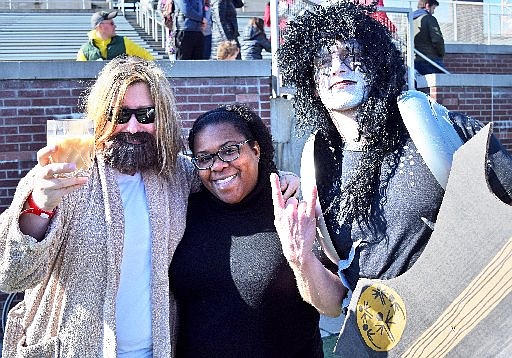 Many Special Olympics supporters came costumed to the polar plunge, adding to the party atmosphere. From left are Christine Ryder, dressed as Jeff Bridges' character in "The Big Lebowski," Gabrielle Sanders and Dylan Phelps, who won the individual prize for his Ace Frehley costume.