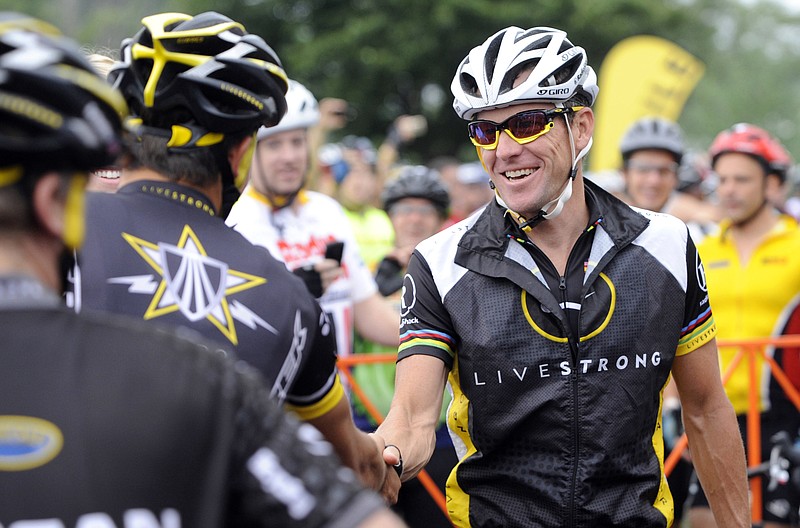 
              FILE - In this Aug. 22, 2010, file photo, cyclist Lance Armstrong greets fellow riders prior to the start of his Livestrong Challenge 10K ride for cancer in Blue Bell, Pa. Lance Armstrong is getting back on his bike, this time to ride and raise money for the charity he founded and was later pressured to leave. Armstrong has set up a fundraising team for the Livestrong Challenge ride in Austin in October. (AP Photo/Bradley C Bower, File)
            