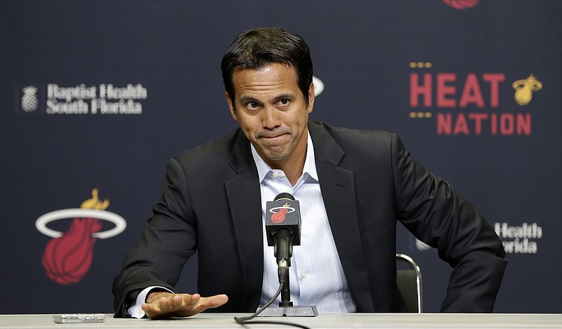 Miami Heat head coach Erik Spoelstra pauses as he talks to reporters on the condition of Heat's forward Chris Bosh in Miami, on Saturday, Feb. 21, 2015. The All-Star forward Bosh will miss at least the remainder of the NBA basketball season because of blood clots on one of his lungs. 