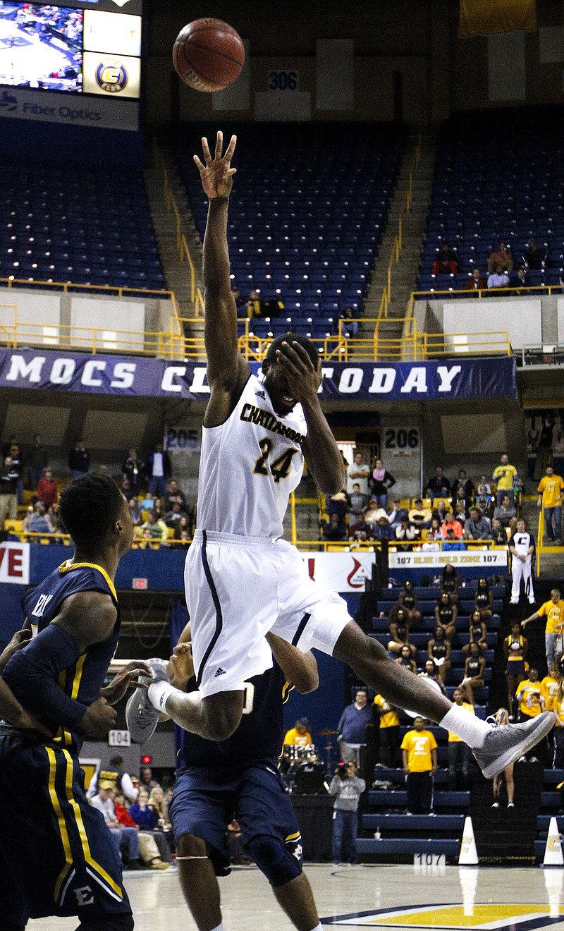 UTC's Casey Jones (24) covers his face as he shoots after being fouled at the start of the Mocs' Senior Night SoCon basketball game against the ETSU Buccaneers on Saturday, Feb. 21, 2015, at McKenzie Arena in Chattanooga, Tenn.