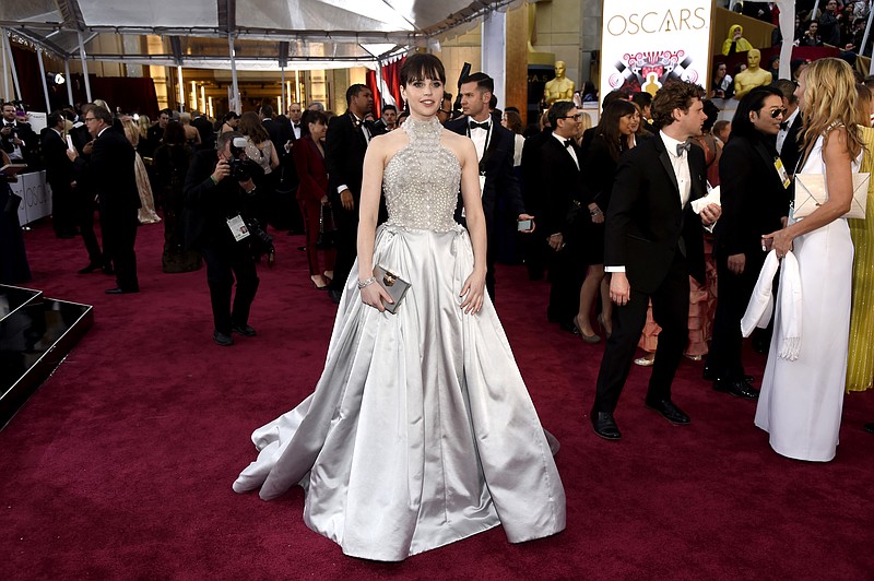 Felicity Jones arrives at the Oscars on Sunday, Feb. 22, 2015, at the Dolby Theatre in Los Angeles.