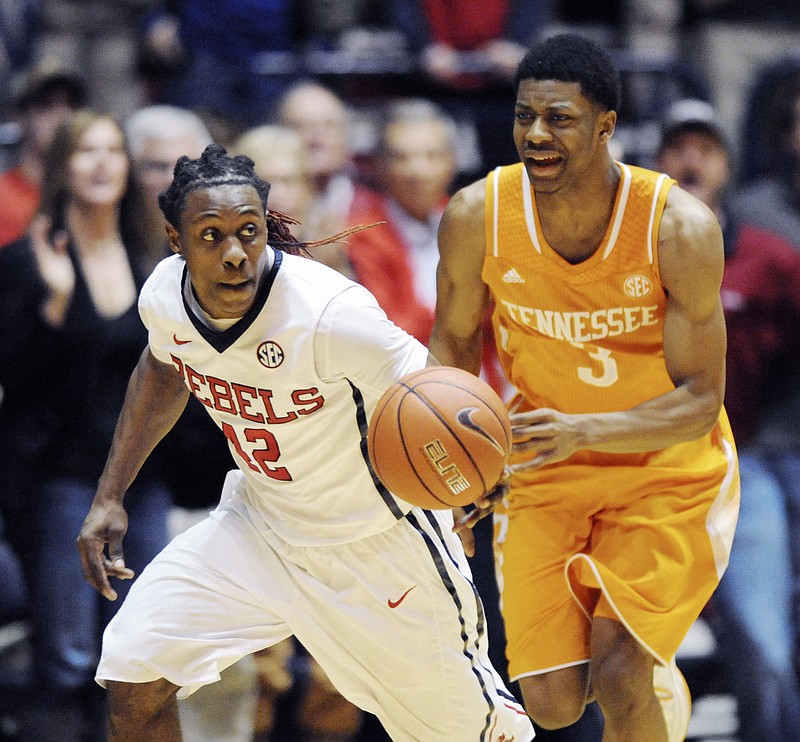 Mississippi guard Stefan Moody (42) brings the ball up court against Tennessee guard Robert Hubbs III (3) during their game on Feb. 21, 2015, in Oxford, Miss. (AP Photo/Oxford Eagle, Bruce Newman) 