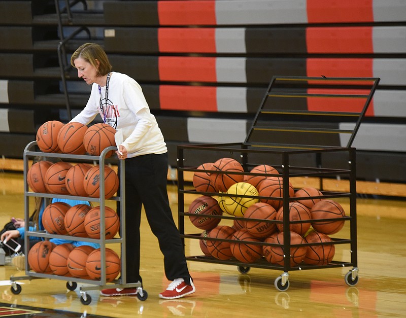 Signal Mountain girls basketball coach Kendra Bell gets ready to work her team during a early afternoon called practice Thursday as school is out for bad weather.