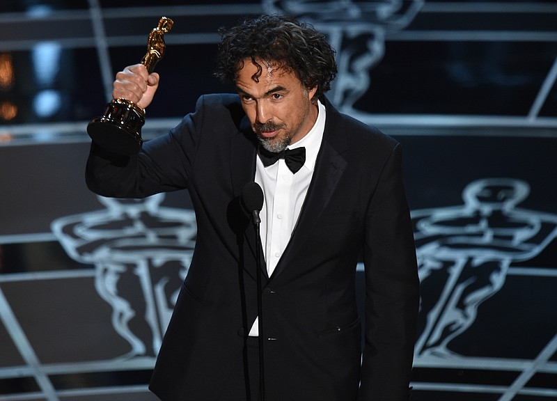 
              Alejandro G. Inarritu accepts the award for best director for “Birdman or (The Unexpected Virtue of Ignorance)” at the Oscars on Sunday, Feb. 22, 2015, at the Dolby Theatre in Los Angeles. (Photo by John Shearer/Invision/AP)
            