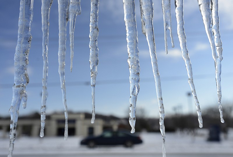 Icicles hang from a building Wednesday, Feb. 18, 2015, in Nolensville, Tenn. The Tennessee Emergency Management Agency says the state remains in a state of emergency as it deals with more snow, subfreezing temperatures and slick roads.
