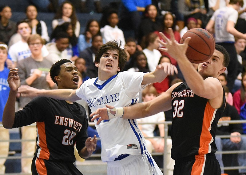 Ensworth's Nick Rolfe (22) and Brycen Hopkins (32) surround McCallie's Mac Hunt (15) to fight for a rebound late in first half action of a Division II state tournament quarterfinal game at McCallie on Monday.