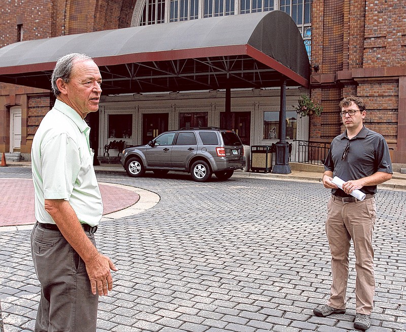 Former Mayor Jon Kinsey, left, and his son, Adam, talk about their plans for the Chattanooga Choo Choo last year after the project was first announced. Delays in approving property tax breaks for the project by the Chattanooga Health, Education and Housing Facilities Board pushed back the start of the work.