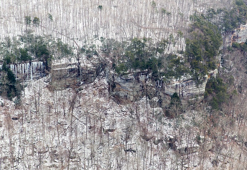 
              Ice and snow are seen from a National Guard helicopter on the Cumberland Plateau near Crossville, Tenn., Tuesday, Feb. 24, 2015. Tennessee Gov. Bill Haslam joined state officials in touring damage from the storm, and urged people to check on their neighbors as the death toll from the storm climbs. (AP Photo/Erik Schelzig)
            
