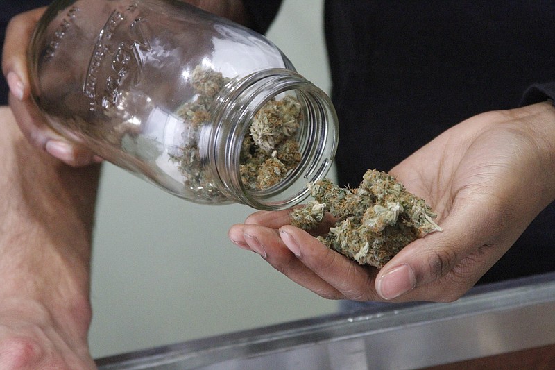 
              In this Feb. 20, 2015 photo, Alaska Cannabis Club CEO Charlo Greene prepares to roll a joint at the medical marijuana dispensary in Anchorage, Alaska. On Tuesday, Feb. 24, 2015, Alaska will become the third state in the nation to legalize marijuana. (AP Photo/Mark Thiessen)
            