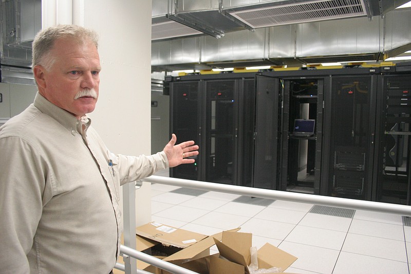 Steve Clark talks about the computer server room in the EPB building at their facilities on Oak Street and Greenwood Avenue in this file photo.