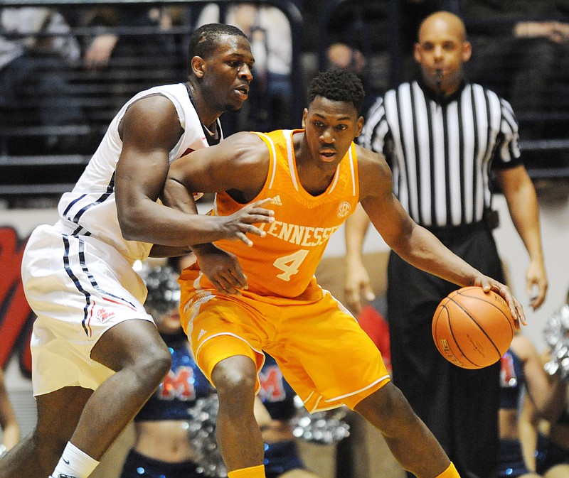Tennessee forward Armani Moore (4) works against Mississippi center Dwight Coleby during theirgame in Oxford, Miss., on Feb. 21, 2015.