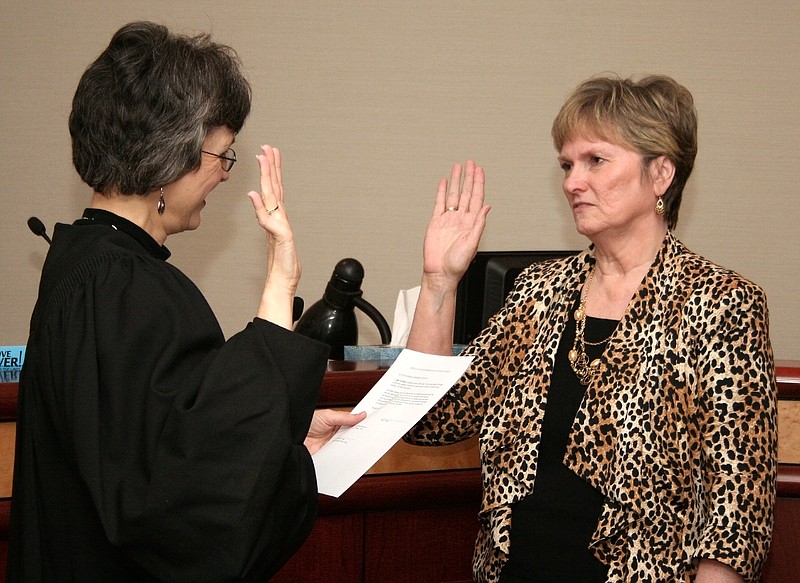 Judy Gilreath takes the oath of office of school superintendent at the Whitfield County Courthouse before Probate Judge Sheri H. Blevins. 
