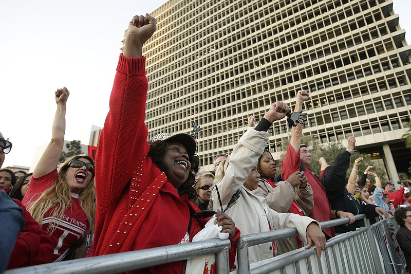 
              Susana Mercado, left, and Linda Cardwell chant slogans as they join thousands of fellow teachers for a rally to demand higher wages and smaller class sizes amid stalled contract negotiations, Thursday, Feb. 26, 2015, in Los Angeles. United Teachers Los Angeles is asking for an 8.5 percent pay increase, a demand the Los Angeles Unified district says cannot be met without significant layoffs. (AP Photo/Jae C. Hong)
            