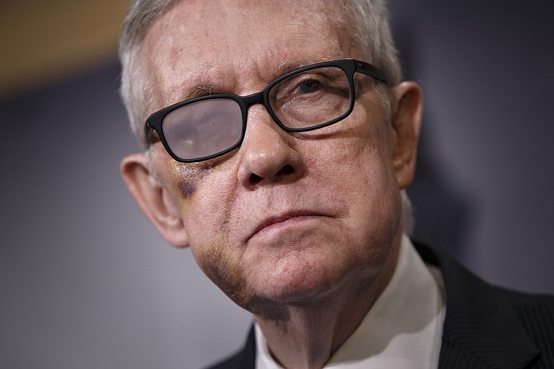 
              Senate Minority Leader Harry Reid of Nev. listens during a news conference on Capitol Hill in Washington, Thursday, Feb. 26, 2015. Reid talked about the impasse over passing the Homeland Security budget because of Republican efforts to block President Barack Obama's executive actions on immigration. Reid is wearing special glasses as he recovers from injuries suffered in a violent exercise accident in December.  (AP Photo/J. Scott Applewhite)
            