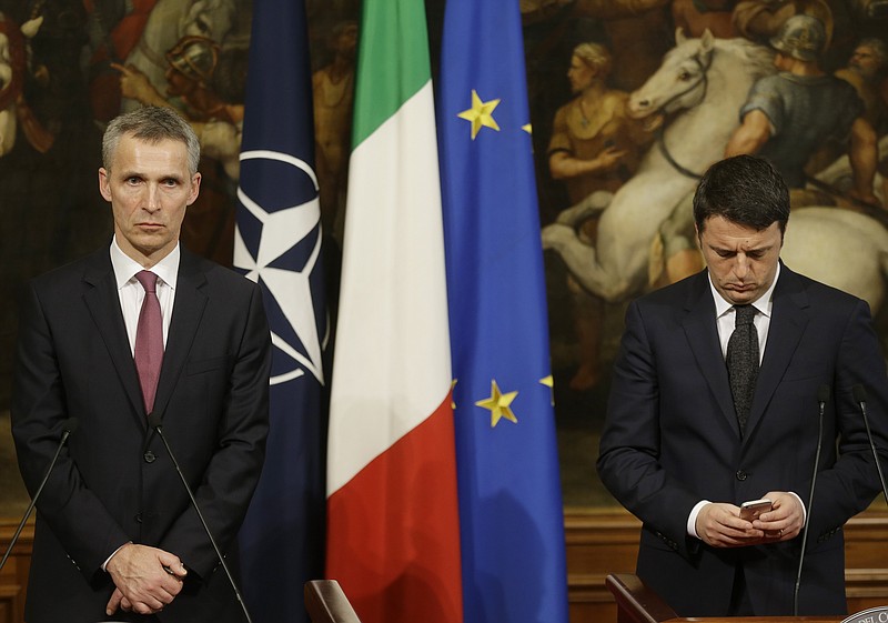 
              Italian Premier Matteo Renzi, right, and NATO Secretary General Jens Stoltenberg meet the journalists at the end of their meeting at Chigi palace premier's office, in Rome, Thursday, Feb. 26, 2015. (AP Photo/Gregorio Borgia)
            