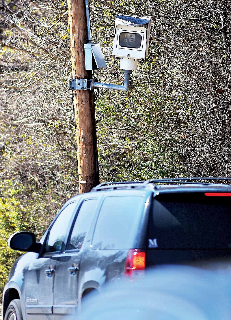 A traffic camera is used to ticket speeders on Barton Avenue.