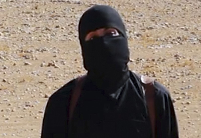 
              FILE - This undated image shows a frame from a video released Friday, Oct. 3, 2014, by Islamic State militants that purports to show the militant who beheaded of taxi driver Alan Henning . A British-accented militant who has appeared in beheading videos released by the Islamic State group in Syria over the past few months bears "striking similarities" to a man who grew up in London, a Muslim lobbying group said Thursday Feb. 26, 2015. Mohammed Emwazi has been identified by news organizations as the masked militant more commonly known as "Jihadi John." London-based CAGE, which works with Muslims in conflict with British intelligence services, said Thursday its research director, Asim Qureshi, saw strong similarities, but because the hood worn by the militant, "there was no way he could be 100 percent certain."  (AP Photo)
            