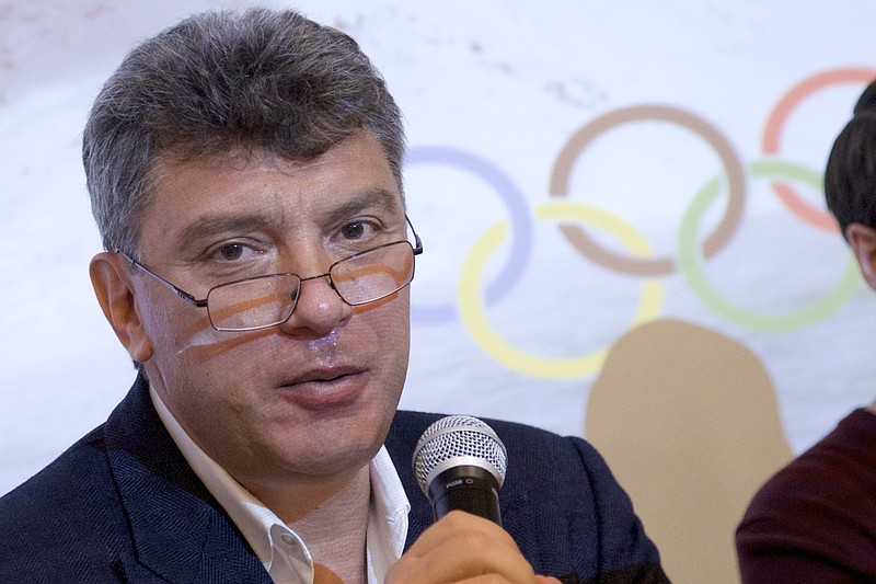 
              FILE  - In this file photo taken on Thursday, May  30, 2013, Boris Nemtsov, a former Russian deputy prime minister and opposition leader, presents a report claiming widespread corruption during preparations for the 2014 Winter Games in Sochi, at a news conference in Moscow, Russia. Russian police say opposition leader Boris Nemtsov has been shot and killed in Moscow.  (AP Photo/Ivan Sekretarev, File)
            