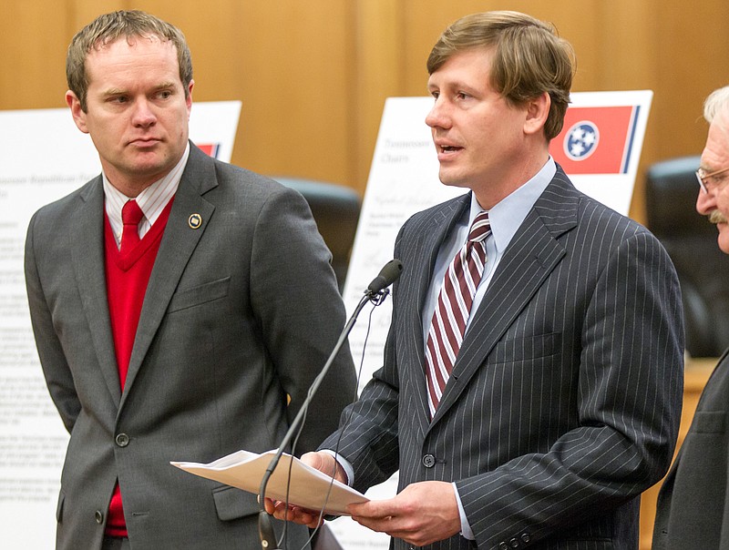 Sen. Brian Kelsey, R-Germantown, speaks at a news conference at the legislative office complex in Nashville, while Rep. Jeremy Durham, R-Franklin, left, listens in this Feb. 2, 2015, photo.