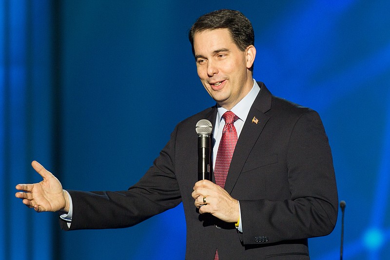 
              In this photo taken Monday, Feb. 23, 2015, Wisconsin Gov. Scott Walker speaks at a National Religious Broadcasters meeting in Nashville, Tenn. Walker and fellow potential Republican presidential candidate Mike Huckabee spoke at the conference. (AP Photo/Erik Schelzig)
            