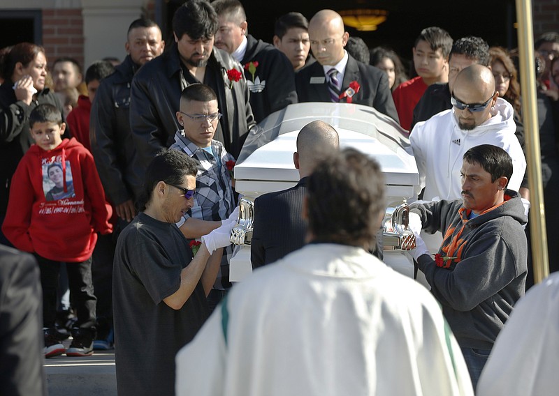 Pallbearers bring the casket of 17-year-old Jessica Hernandez out of the church to a waiting hearse after a funeral Mass in Westminster, Colo. on Feb. 7, 2015. 