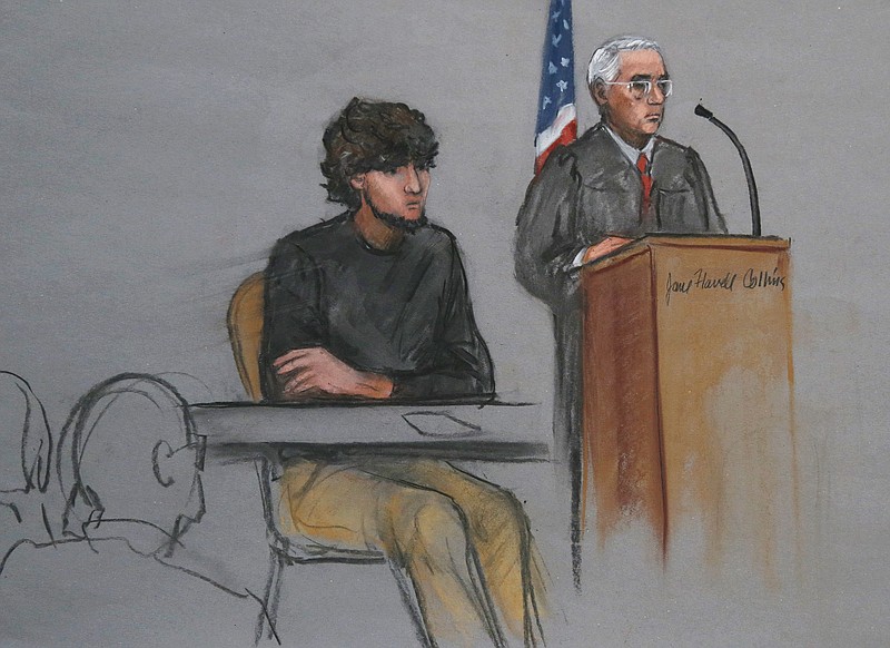 Boston Marathon bombing suspect Dzhokhar Tsarnaev, left, is depicted beside U.S. District Judge George O'Toole Jr., right, as O'Toole addresses a pool of potential jurors in a jury assembly room at the federal courthouse, in Boston in this Jan. 5, 2015, file courtroom sketch.