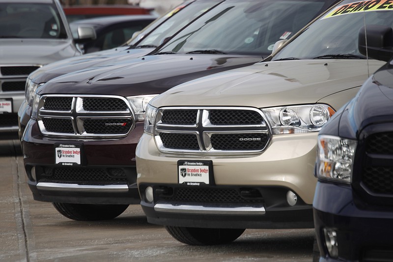 
              FILE - In this Sunday, Jan. 20, 2013, file photo, a line of unsold 2012 Durango sports-utility vehicles sits at a Dodge dealership in Littleton, Colo. Fiat Chrysler is adding more than 467,000 Dodge and Jeep SUVs worldwide to a 2014 recall to fix a potential stalling problem. The company says it's adding 2012 and 2013 Dodge Durangos and 2011 Jeep Grand Cherokees outside North America to a recall from September of last year. The Jeeps have diesel engines. (AP Photo/David Zalubowski, File)
            