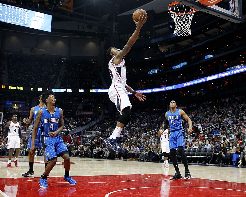 Atlanta Hawks guard Jeff Teague (0) goes up for a shot during their game against the Orlando Magic on Friday, Feb. 27, 2015, in Atlanta. The Hawks won 95-88.