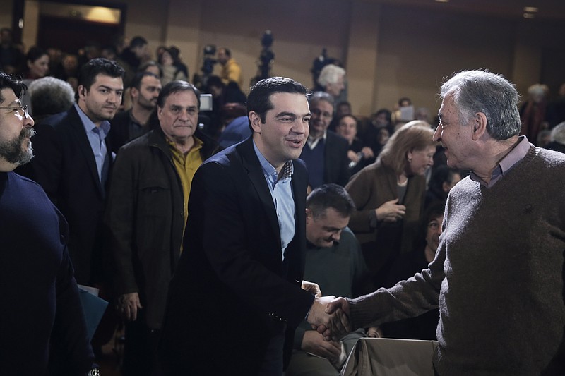 
              Greek Prime Minister and Syriza leader Alexis Tsipras, centre, arrives at his party central committee, in Athens, on Saturday, Feb. 28, 2015. Greece's new radical left government has no intention of seeking yet another bailout deal from international creditors and will spend coming months trying to ease the terms of its current commitments, the financially struggling country's prime minister said Friday.(AP Photo/Petros Giannakouris)
            