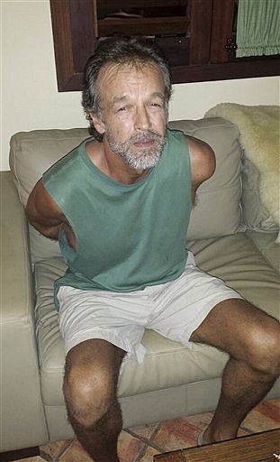 American sect leader Victor Arden Barnard sits in a police station after being detained at Pipa beach, in Brazil on Feb. 27, 2015, in this photo released by Rio Grande do Norte State Security secretary.