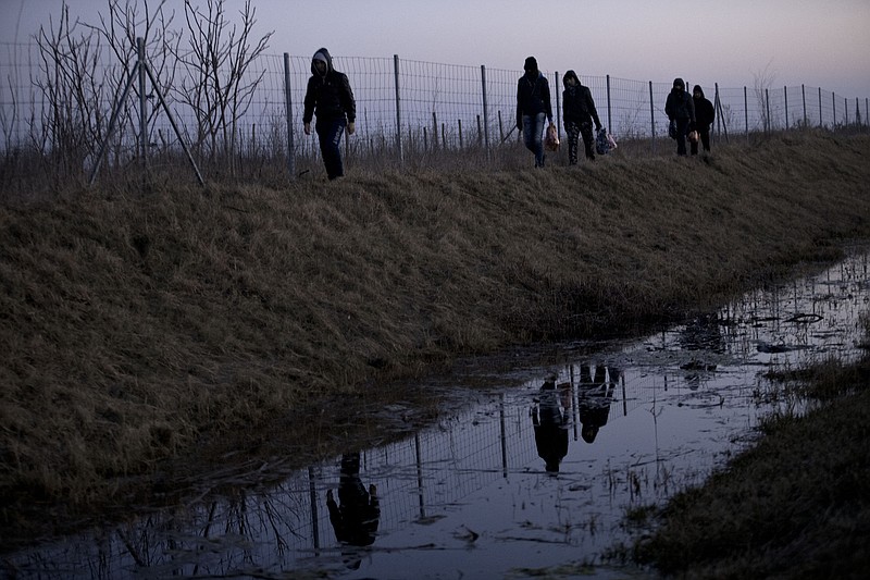 
              In this photo taken Tuesday, Feb. 17, 2015, Afghan migrants trek their way to the Serbian border with Hungary close to Hajdukovo, 150 kilometers north of Belgrade, Serbia. Thousands of migrants from the Middle East and Africa have been flocking to Serbia’s border with Hungary, hoping to cross illegally into the European Union in search of a better life. (AP Photo/Marko Drobnjakovic)
            