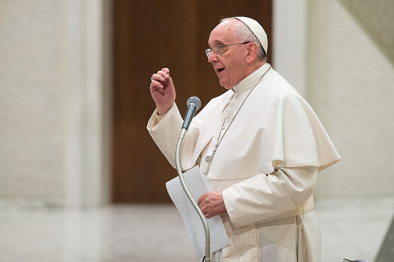 
              Pope Francis delivers his message on the occasion of an audience granted to members of the Italian Confcooperative, cooperative associations, in the Paul VI hall at the Vatican, Saturday, Feb. 28, 2015. (AP Photo/L'Osservatore Romano, Pool)
            