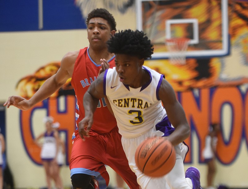 Central's Tre Tiller heads past Brainerd's Jessie Walker on Monday at Chattanooga State Community College.