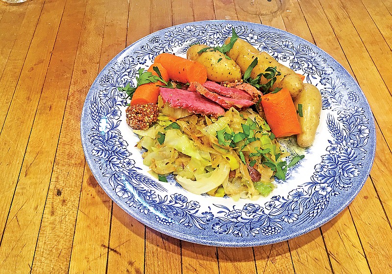 Corned beef prepared in the slow cooker along with cabbage, carrots and fingerling potatoes makes for a delicious meal, and the meat can be used again later for Reuben sandwiches.