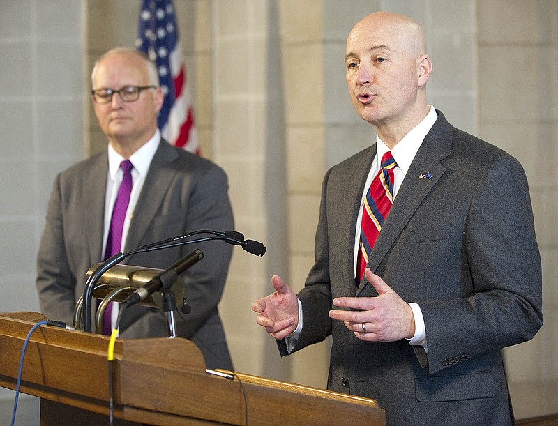 
              Nebraska Gov. Pete Ricketts, right, speaks during a news conference, Monday, March 2, 2015, at the state capitol in Lincoln, Neb. Nebraska Attorney General Doug Peterson stands at left. Ricketts is denouncing a federal judge's decision to strike down Nebraska's constitutional amendment that defines marriage as between one man and one woman. (AP Photo/The Journal-Star, Eric Gregory) LOCAL TV OUT, KOLN, KGIN, KLKN
            