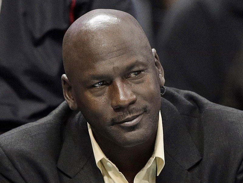 Charlotte Bobcats owner Michael Jordan watches an NBA basketball game in this April 16, 2014, file photo.