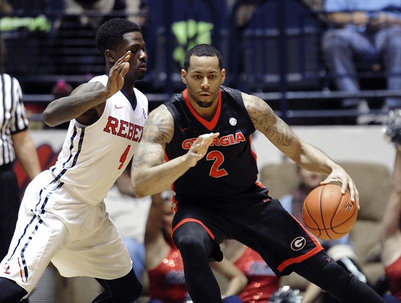 Georgia forward Marcus Thornton (2) is defended by Mississippi forward M.J. Rhett (4) during an NCAA college basketball game Wednesday, Feb. 25, 2015, in Oxford, Miss.