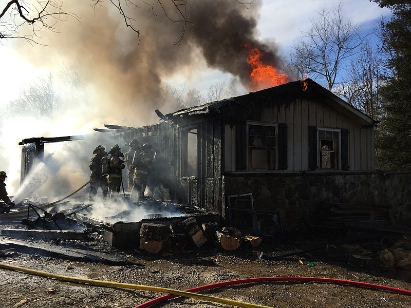 Walden's Ridge Emergency Service personnel respond to a house fire located at 2045 Oak Street on Signal Mountain.