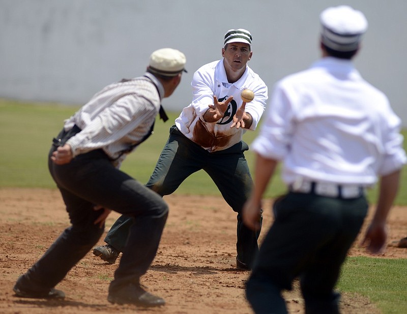 A play from the 2014 Father's Day vintage baseball game at Engel Stadium.