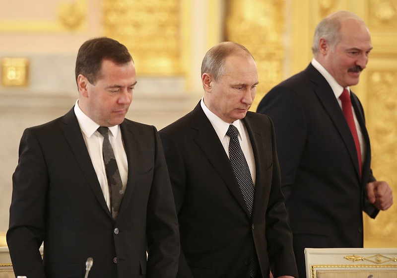 
              Russian President Vladimir Putin, center, Russian Prime Minister Dmitry Medvedev, left, and Belarusian President Alexander Lukashenko attend a meeting in the Kremlin in Moscow,  Russia, Tuesday, March 3, 2015. (AP Photo/Sergei Karpukhin, Pool)
            